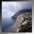 Dark clouds threatening rain float over a resort town on the Amalfi Coast